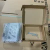 TS01 carbon steel tablet stand unpacking view, product with bubble wrap and installation wrench tools